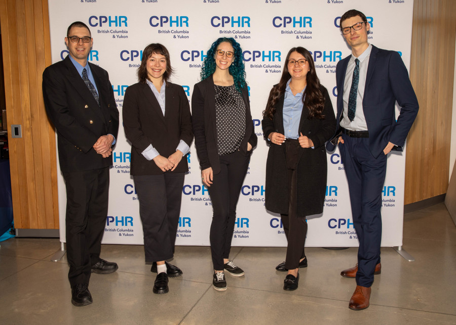 Five people wearing dark business attire stand in front of a white background with the words CPHR British Columbia & Yukon